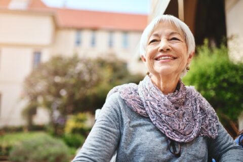 A senior woman enjoys her retirement community.